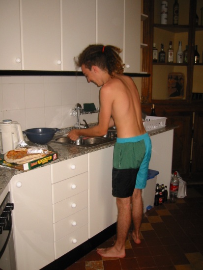 Martin washing dishes just after he and his friends arrived