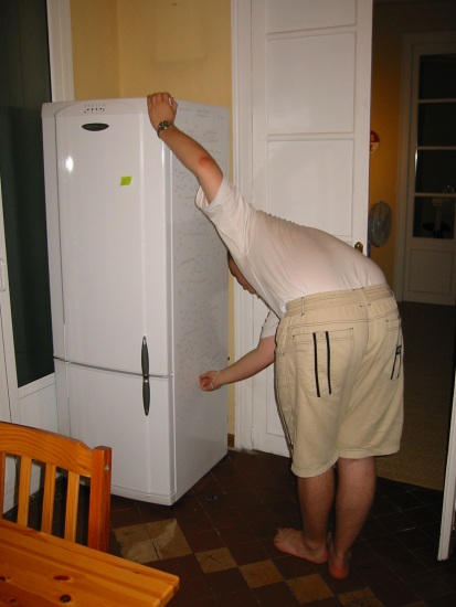 Julien having fun with my geeky fridge magnets
