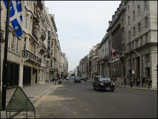 A typical London center street with some also typical taxis
