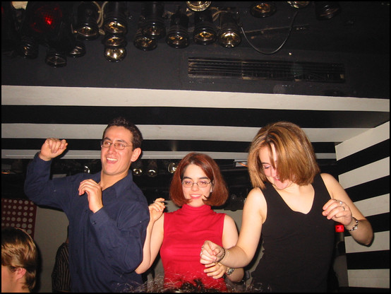 Raoul, Aida and Ana dancing on a stage